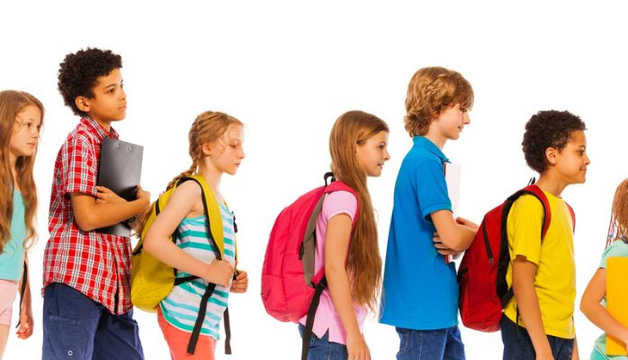 Children carrying backpacks